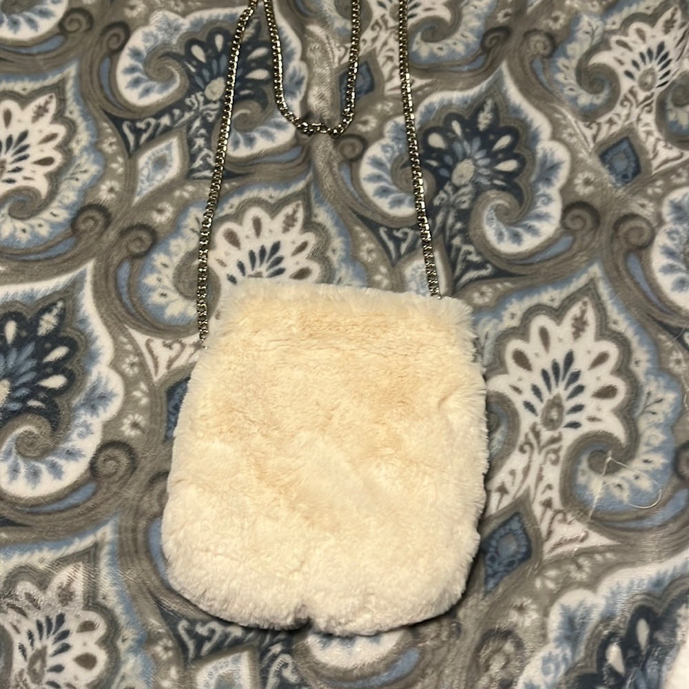 White fur small bag, only use a few times, no brand in bag